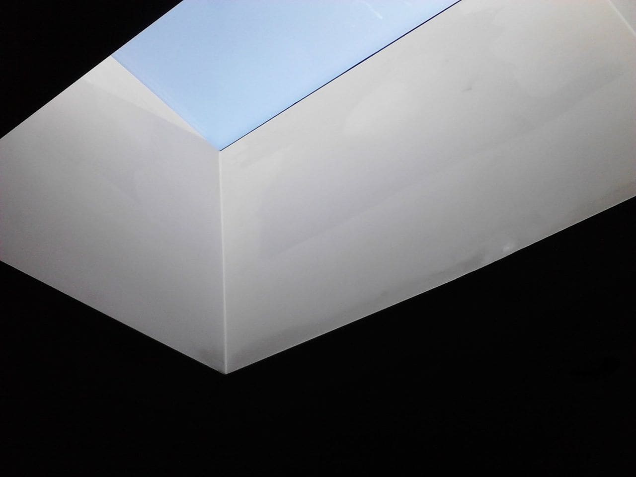 A white skylight in the middle of a room.