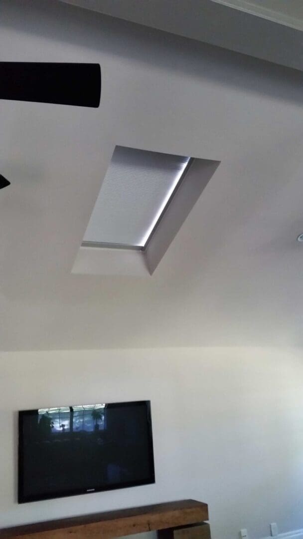 A skylight in the ceiling of a room.