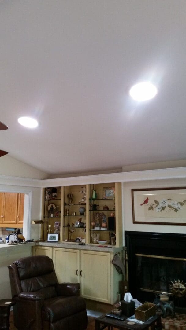 A living room with two lights on the ceiling