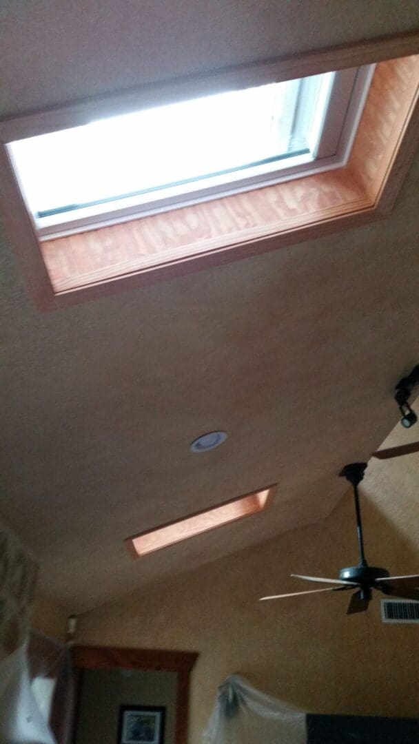 A skylight in the ceiling of a room with no walls.