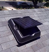 A solar powered vent on the roof of a house.