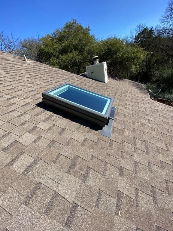 A skylight on the roof of a house.